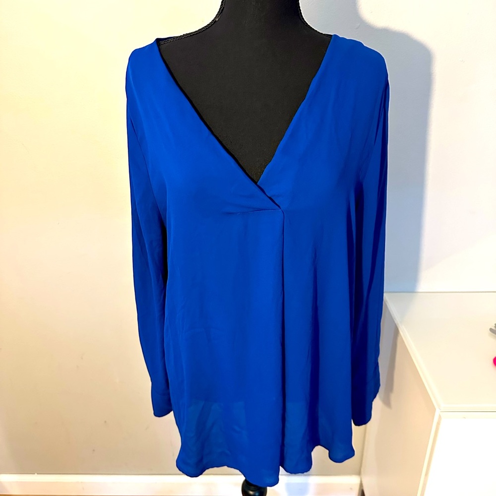 Royal blue crepe top with long sleeves. Size large